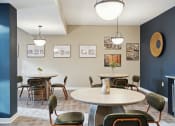 Thumbnail 19 of 24 - Dining room with tables and chairs and a wall with pictures  at The Anchorage on Kelly, Philadelphia