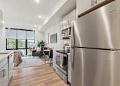 Thumbnail 16 of 57 - A modern kitchen with a large stainless steel refrigerator.