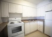Thumbnail 19 of 23 - Kitchen with White Appliances