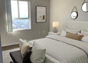 Thumbnail 4 of 20 - a bedroom with a large bed and a window
