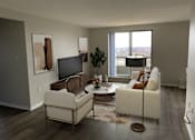 Thumbnail 5 of 20 - a living room with a couch and a tv