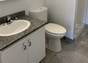 Thumbnail 10 of 20 - a small bathroom with a toilet and a sink