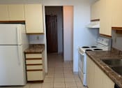 Thumbnail 13 of 20 - a kitchen with white cabinets and a refrigerator and a sink