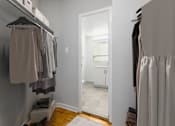 Thumbnail 5 of 12 - A hallway with a white door and a white wall.