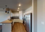 Thumbnail 27 of 33 - Fully Furnished Kitchen at First Street Lofts in Downtown Bismarck, Bismarck, ND, 58506