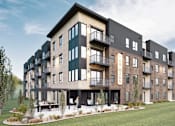 Thumbnail 1 of 3 - A modern apartment complex with balconies and a landscaped courtyard.
