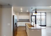 Thumbnail 25 of 33 - Island Kitchen at First Street Lofts in Downtown Bismarck, North Dakota, 58506