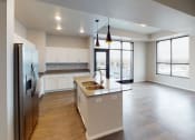 Thumbnail 26 of 33 - Kitchen And Living at First Street Lofts in Downtown Bismarck, Bismarck, ND
