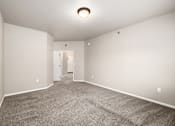 Thumbnail 14 of 28 - A room with carpeted floor and white walls.