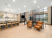 Thumbnail 35 of 61 - A modern kitchen with wooden floors and furniture.