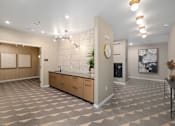 Thumbnail 58 of 61 - A kitchen area with a checkered floor and a wall clock.