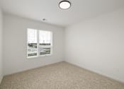 Thumbnail 51 of 61 - A room with a window and a carpeted floor.