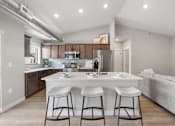 Thumbnail 1 of 76 - A modern kitchen with a bar stool in front of the island.