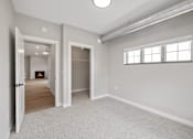 Thumbnail 51 of 76 - A spacious room with a fireplace and a window.