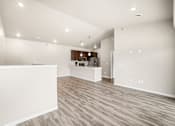 Thumbnail 34 of 39 - A spacious room with wooden flooring and a white reception desk.