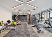Thumbnail 45 of 88 - A gym with weights and benches for weight lifting