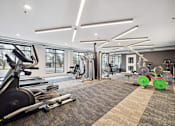 Thumbnail 50 of 88 - A gym with cardio equipment and weight equipment.