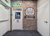 Thumbnail 43 of 88 - A door with a sign next to it that says The Ascent Clubhouse