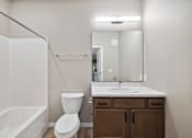 Thumbnail 68 of 88 - A bathroom with wood toned vanity