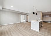 Thumbnail 63 of 88 - A kitchen with island and brown cabinets.