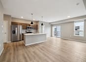 Thumbnail 62 of 88 - A kitchen with island and brown cabinets.