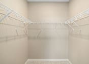 Thumbnail 26 of 61 - Empty white shelves in a room.