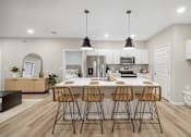 Thumbnail 13 of 88 - a large dining room with tables and chairs and white walls