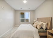 Thumbnail 17 of 88 - a bedroom with a large bed and a window