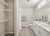 Thumbnail 19 of 88 - a bathroom with a sink and a shower and a toilet