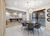 Thumbnail 27 of 88 - a dining area with a round table and chairs and a glass sliding door