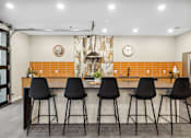 Thumbnail 26 of 88 - a kitchen with a counter top and bar stools