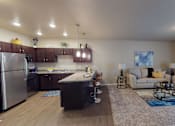 Thumbnail 2 of 28 - Kitchen And Living Area at Cascades of Mandan, Mandan, ND