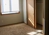 Thumbnail 3 of 18 - A room with a ceiling fan and a window with blinds.
