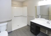 Thumbnail 32 of 32 - a bathroom with a toilet sink and shower