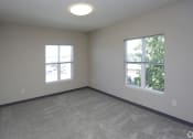 Thumbnail 21 of 32 - an empty room with two windows