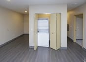 Thumbnail 30 of 32 - an empty room with a washer and dryer