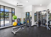 Thumbnail 28 of 43 - the exercise room is equipped with cardio equipment and weights
