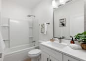 Thumbnail 16 of 43 - a bathroom with a sink toilet and a bath tub