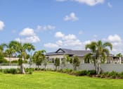 Thumbnail 38 of 43 - the exterior of a house with palm trees in front of it