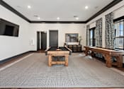 Thumbnail 45 of 52 - A room with a pool table and a television at Town Madison, Madison, 35758