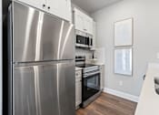 Thumbnail 35 of 52 - A modern kitchen with a stainless steel refrigerator at Town Madison, Madison, AL