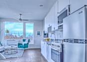 Thumbnail 1 of 18 - Kitchen with Wooden Floor at Sloan's Place Apartments, Denver, 80214