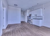 Thumbnail 12 of 18 - Kitchen with White Cabinets at Sloan's Place Apartments, Colorado