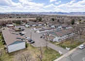 Thumbnail 19 of 19 - arial view of a neighborhood of houses with cars parked in the parking lot