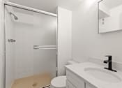 Thumbnail 10 of 19 - a bathroom with a sink and a shower
