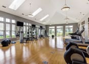 Thumbnail 5 of 15 - The Oaks of Vernon Hills - Fitness Center with Cardio Machines & Natural Light