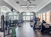 Thumbnail 4 of 20 - Apartments in Aurora, IL for Rent - Kirkland Crossing - Fitness Center with Treadmills, Free Weights, and a Stationary Bike