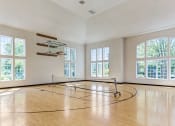 Thumbnail 5 of 20 - Apartments for Rent in Aurora, IL - Kirkland Crossing - Basketball Court with a Basketball Hoop, High Ceilings, and Large Windows