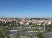 Thumbnail 27 of 30 - A suburban area with houses and roads.