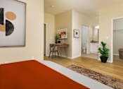 Thumbnail 5 of 30 - A room with a brown rug and a painting on the wall.